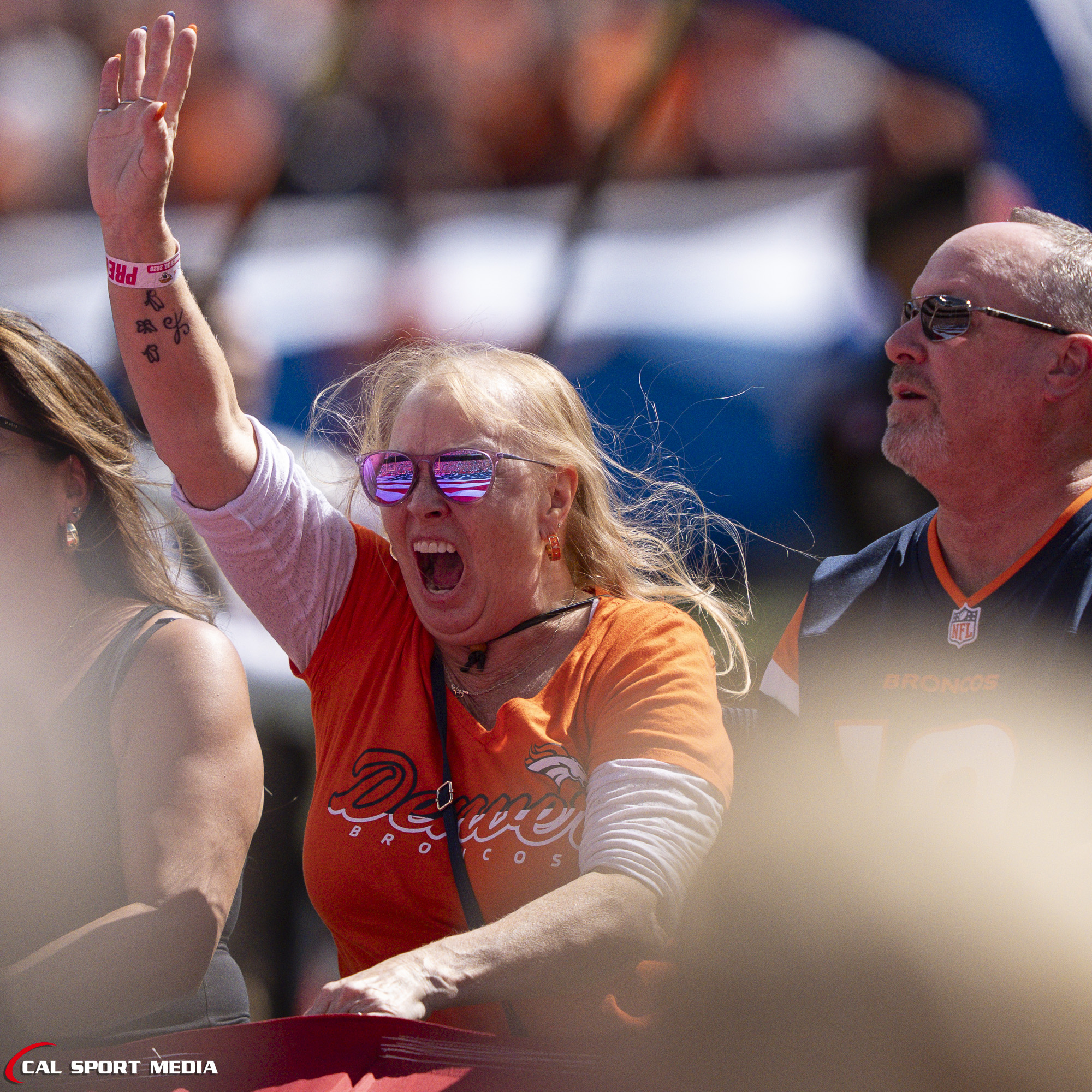 Sep 20, 2026; A fBroncos fan has fun holding the flag for the National Anthem before the game between the Denver Broncos and Jacksonville Jaguars in Denver, CO, USA; at Empower Field at Mile High. Mandatory Credit: Derek Regensburger-Cal Sport Media