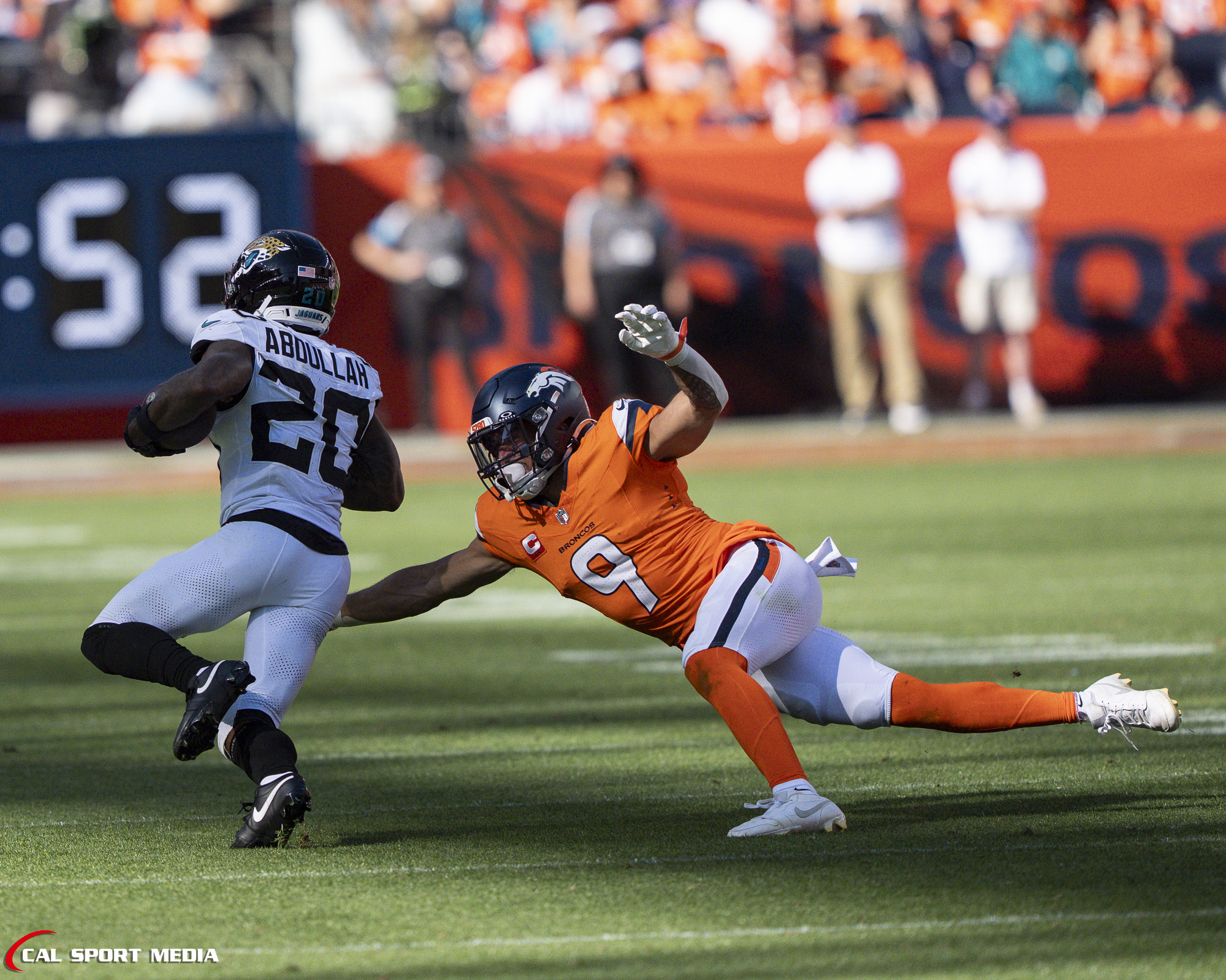 Sep 20, 2026; Denver Broncos safety Talanoa Hufanga (9) tackles Jacksonville Jaguars running back Ameer Abdullah (20) during the game between the Denver Broncos and Jacksonville Jaguars in Denver, CO, USA; at Empower Field at Mile High. Mandatory Credit: Derek Regensburger-Cal Sport Media
