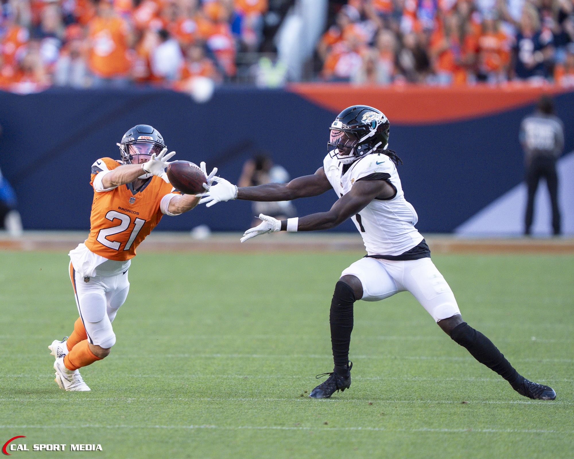 Sep 20, 2026; Denver Broncos cornerback Riley Moss (21) breaks up a pass during the game between the Denver Broncos and Jacksonville Jaguars in Denver, CO, USA; at Empower Field at Mile High. Mandatory Credit: Derek Regensburger-Cal Sport Media